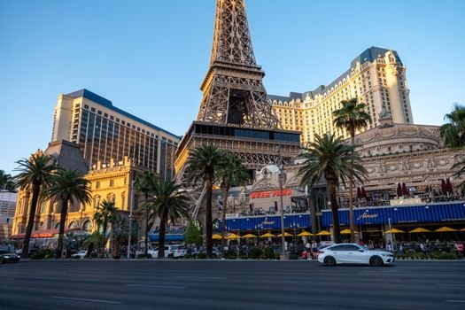 View of the Paris Las Vegas Hotel with its Eiffel Tower replica during daytime, showcasing vibrant city life.